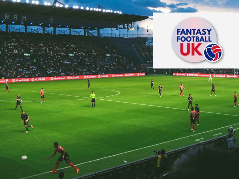 Fantasy Football UK logo in a white box over an image of a football match in Thailand